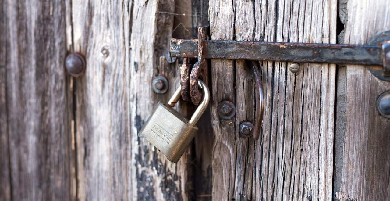 Lock on a rusted gate latch